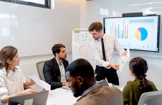 Caucasian manager discuss with their staff with serious condition during conference in meeting room.