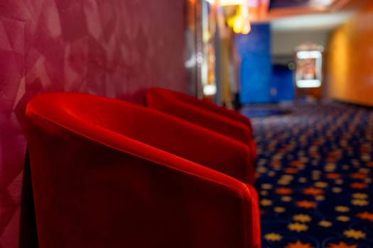 Side view area of in front gate of the movie theater with red chair. Concept of happy time for entertainment to relax on holiday.