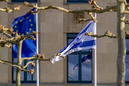 EU and Israeli flags flutter in the wind. High quality photo