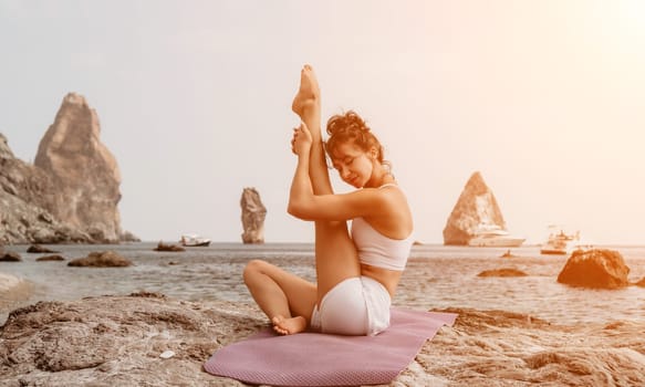 Fitness woman sea. Outdoor workout on yoga mat in park near to ocean beach. Female fitness pilates yoga routine concept. Healthy lifestyle. Happy fit woman exercising with rubber band in park.