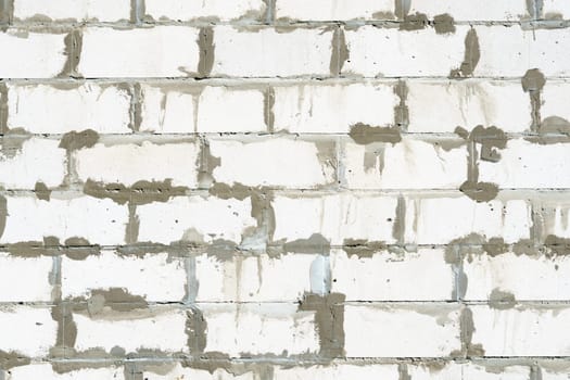 Textured Bricks, stone Background. The worn facade of the building