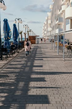 coastal area with apartment buildings of residential areas, modern hotel and restaurant complex on water and sandy beaches