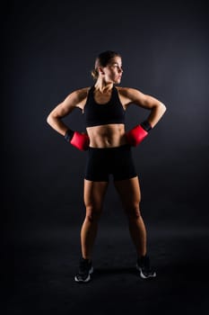 Young woman athletic female MMA fighter is training. Concept of sport, action, healthy lifestyle.