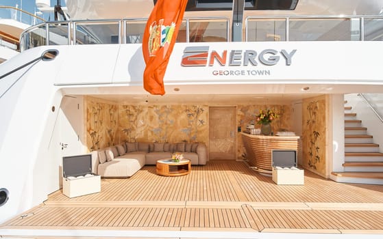 Monaco, Monte Carlo, 29 September 2022 - Close-up view of a relaxation area on the open teak deck of an expensive mega yacht on famous boating exhibition at sunny day, yacht show, wealth life. High quality photo