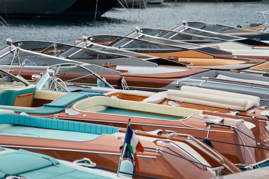 Few luxury retro motor boats in row at the famous motorboat exhibition in the principality of Monaco, Monte Carlo, the most expensive boats for the richest people, boats for rich clients