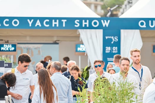 Monaco, Monte Carlo, 29 September 2022 - The famous motorboat exhibition, mega yacht show, clients and yacht brokers discuss the novelties of the boating industry, look at the mega yachts presented. High quality photo