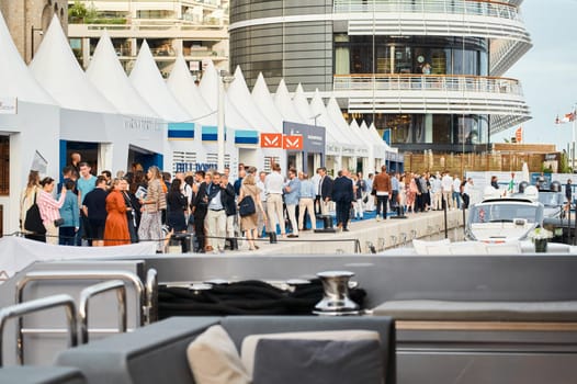 Monaco, Monte Carlo, 29 September 2022 - The famous motorboat exhibition, mega yacht show, clients and yacht brokers discuss the novelties of the boating industry, look at the mega yachts presented. High quality photo