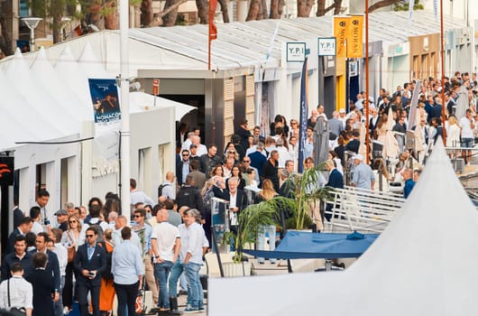 Monaco, Monte Carlo, 29 September 2022 - The famous motorboat exhibition, mega yacht show, clients and yacht brokers discuss the novelties of the boating industry, look at the mega yachts presented. High quality photo