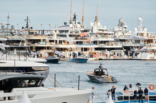 Monaco, Monte Carlo, 29 September 2022 - The famous motorboat exhibition, mega yacht show, clients and yacht brokers discuss the novelties of the boating industry, look at the mega yachts presented. High quality photo