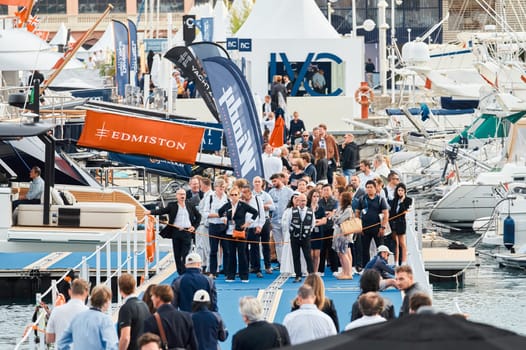 Monaco, Monte Carlo, 29 September 2022 - The famous motorboat exhibition, mega yacht show, clients and yacht brokers discuss the novelties of the boating industry, look at the mega yachts presented. High quality photo