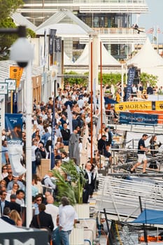 Monaco, Monte Carlo, 29 September 2022 - The famous motorboat exhibition, mega yacht show, clients and yacht brokers discuss the novelties of the boating industry, look at the mega yachts presented. High quality photo