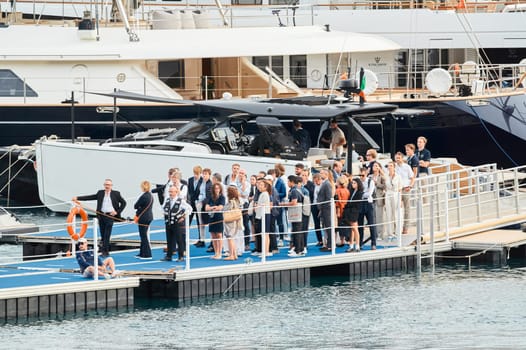 Monaco, Monte Carlo, 29 September 2022 - The famous motorboat exhibition, mega yacht show, clients and yacht brokers discuss the novelties of the boating industry, look at the mega yachts presented. High quality photo