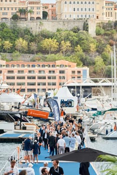 Monaco, Monte Carlo, 29 September 2022 - The famous motorboat exhibition, mega yacht show, clients and yacht brokers discuss the novelties of the boating industry, look at the mega yachts presented. High quality photo