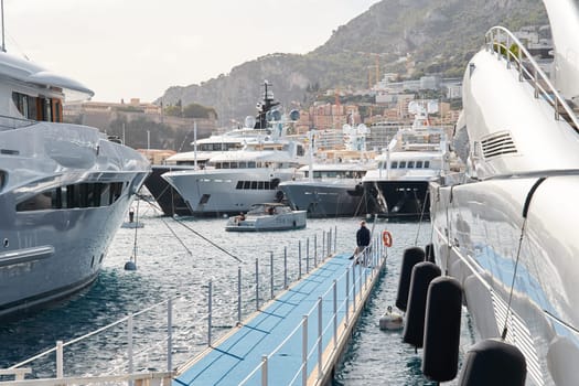 Monaco, Monte Carlo, 29 September 2022 - a lot of luxury yachts at the famous motorboat exhibition, the most expensive boats for the richest people, yacht brokers, boat traffic. High quality photo