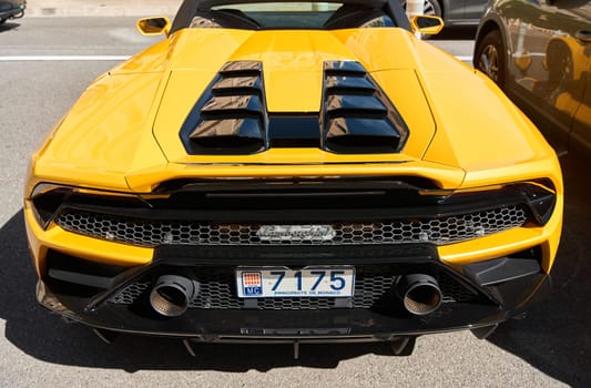 Monaco, Monte Carlo, 29 September 2022 - Close-up view of yellow sports car Lamborghini on street. High quality photo