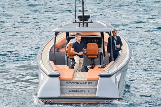 Monaco, Monte Carlo, 29 September 2022 - Water taxi by luxury motorboat on the famous yacht exhibition, a lot of most expensive luxury yachts, richest people, yacht brokers, boat traffic. High quality photo