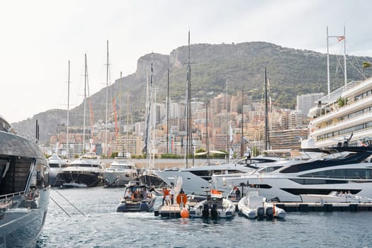 Monaco, Monte Carlo, 29 September 2022 - a lot of luxury yachts at the famous motorboat exhibition, the most expensive boats for the richest people, yacht brokers, boat traffic. High quality photo