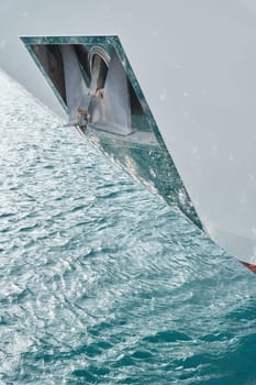 Sun glare on glossy board of mega yacht, anchor, tranquillity in port Hercules, bow of moored huge boat at sunny day, Monaco, Monte-Carlo. High quality photo