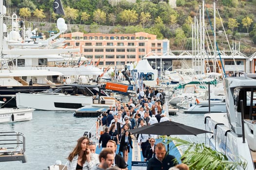 Monaco, Monte Carlo, 29 September 2022 - The famous motorboat exhibition, mega yacht show, clients and yacht brokers discuss the novelties of the boating industry, look at the mega yachts presented. High quality photo