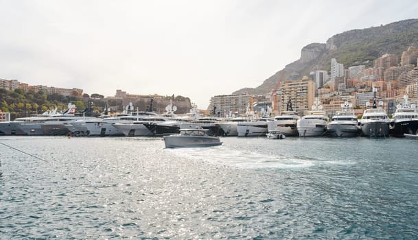 Monaco, Monte Carlo, 29 September 2022 - a lot of luxury yachts at the famous motorboat exhibition, the most expensive boats for the richest people, yacht brokers, boat traffic. High quality photo