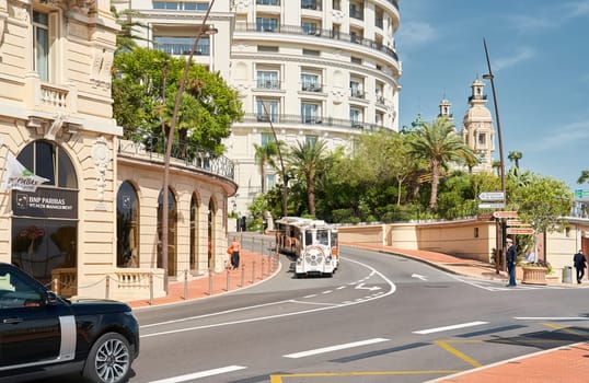 Monaco, Monte-Carlo, 29 September 2022 - Famous landmark Casino Monte-Carlo and hotel de Paris at sunny day, lifestyle of principality, wealth life, expensive luxury cars, sightseeing. High quality photo