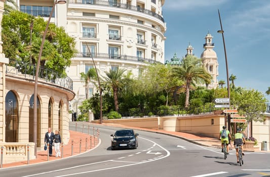 Monaco, Monte-Carlo, 29 September 2022 - Famous landmark Casino Monte-Carlo and hotel de Paris at sunny day, lifestyle of principality, wealth life, expensive luxury cars, sightseeing. High quality photo