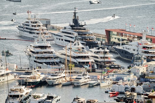 Monaco, Monte Carlo, 01 October 2022 - The famous motorboat exhibition at morning, mega yacht show, novelties of the boating industry. High quality photo