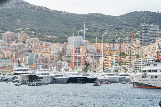 Monaco, Monte Carlo, 29 September 2022 - a lot of luxury yachts at the famous motorboat exhibition, the most expensive boats for the richest people, yacht brokers, boat traffic. High quality photo