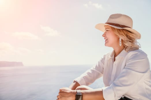 Happy girl doing yoga with laptop working at the beach. beautiful and calm business woman sitting with a laptop in a summer cafe in the lotus position meditating and relaxing. freelance girl remote work beach paradise