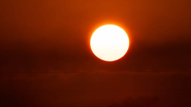 Beautiful nature morning with orange, yellow sunshine and fluffy clouds. Beautiful colorful dramatic sky with clouds at sunset or sunrise.