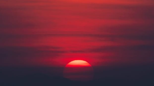 Beautiful nature morning with orange, yellow sunshine and fluffy clouds. Beautiful colorful dramatic sky with clouds at sunset or sunrise.