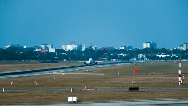 Airplane taking off from the airport. Plane on runway. Runway at the airport and the plane flies.