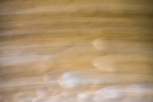 Abstract gradient blue, green and brown light background texture with horizontal motion blur