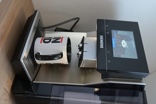 Siemens EQ.700 fully automatic coffee machine with a coffee cup