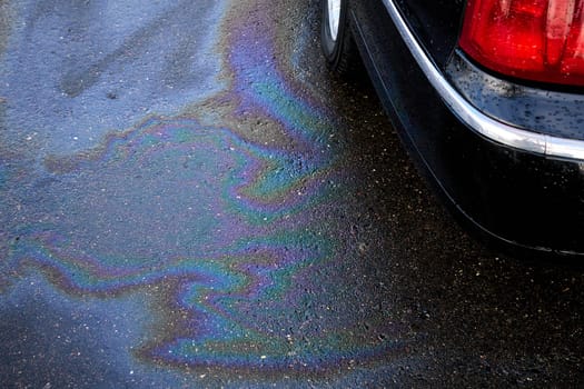 Engine oil stains of car. Leak under the car when the car is park.