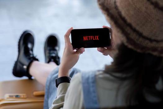 CHIANG MAI, THAILAND JAN 2, 2024: Netflix logo on iPhone 14 screen. Netflix is an international leading subscription service for watching TV episodes and movies.