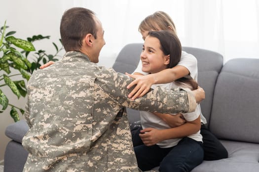 military father and two daughters at home. High quality photo