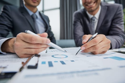 two businessmen watching a growth chart close-up