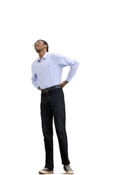 A man in a gray shirt, on a white background, full-length, back pain.