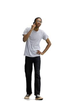 A man in a gray T-shirt, on a white background, with a phone.