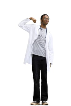 A male doctor, on a white background, in full height, shows strength.