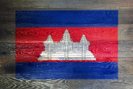 A Cambodia flag on rustic old wood surface background blue red white Angkor Wat