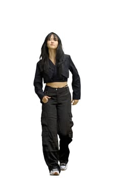 A woman in black clothes, on a white background, in full height, is walking.