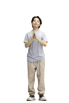 A guy in a gray T-shirt, on a white background, full-length, dreaming.