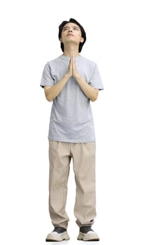 A guy in a gray T-shirt, on a white background, full-length, begging.