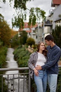 Young Cute Female Hugs Boyfriend. In Autumn Outdoor. Lovers Walking in Park. Attractive Funny Couple. Lovestory in Forest. Man and Woman. Cute Lovers in the Park. Family Concept. Happy Couple.