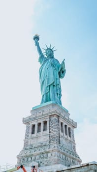 The Statue of Liberty, New York City on sunny blue sky. American symbol. Memorial day, Patriot Day. Space for text. New York NY USA 2023-07-30.