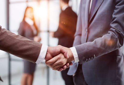 Nice to meet you. Close-up of two young businessmen shaking hands