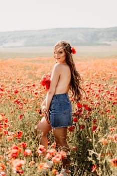 Woman poppies field. portrait of a happy woman with long hair in a poppy field and enjoying the beauty of nature in a warm summer day