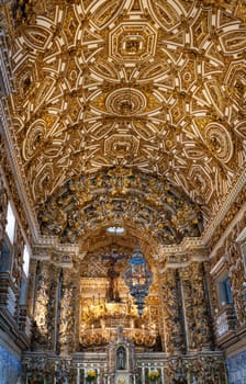 Baroque ceiling with gold leaf in historic church.